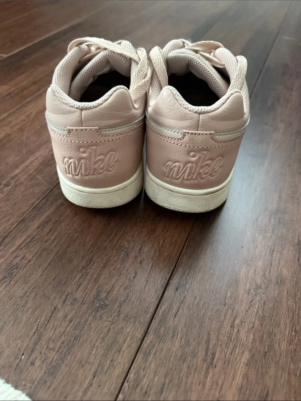 Nike Women's Blush Pink Low-Top Sneakers with Cream Swoosh